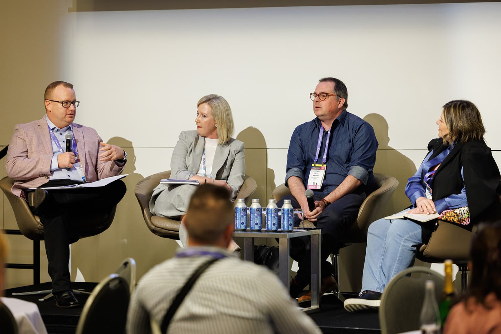 A panel session on stage at the ALPMA Summit
